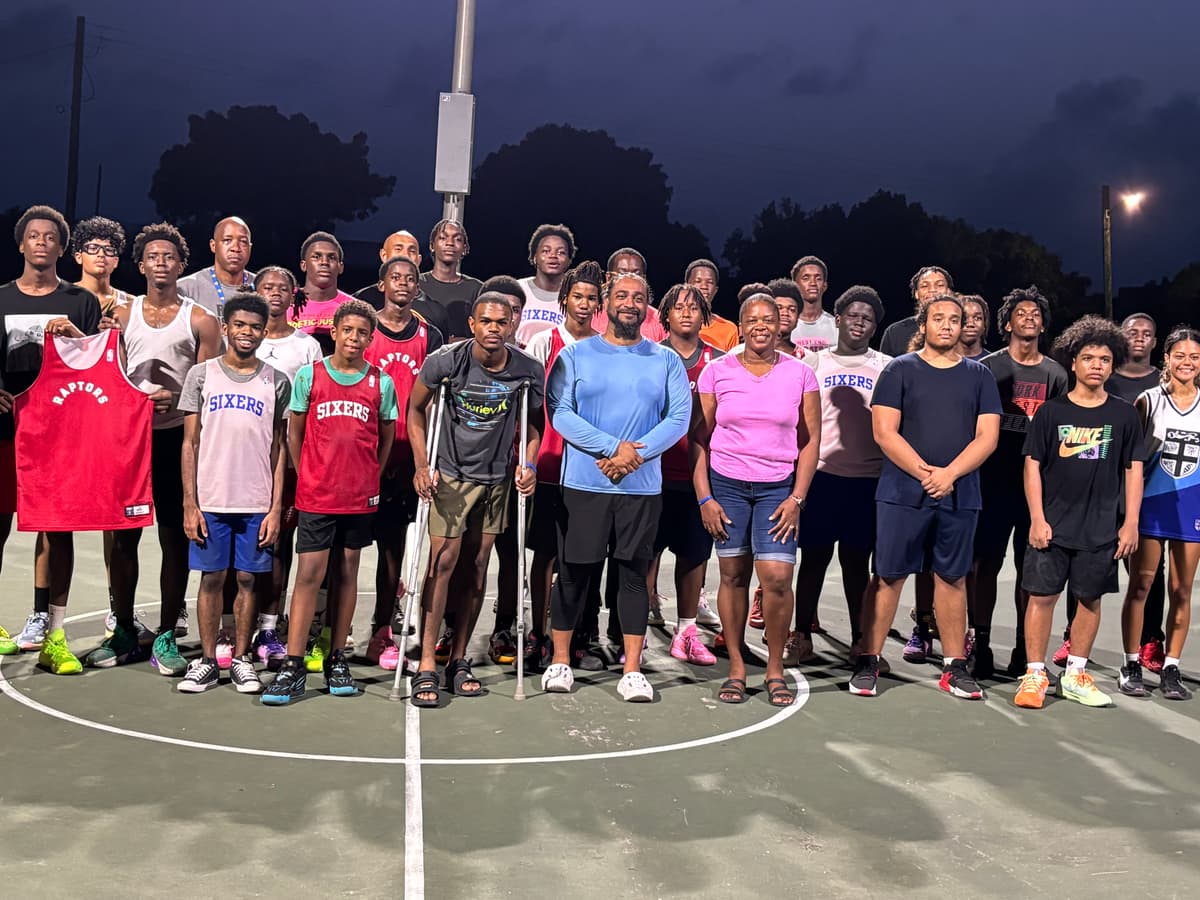 Basketball camp participants and coaches on the court