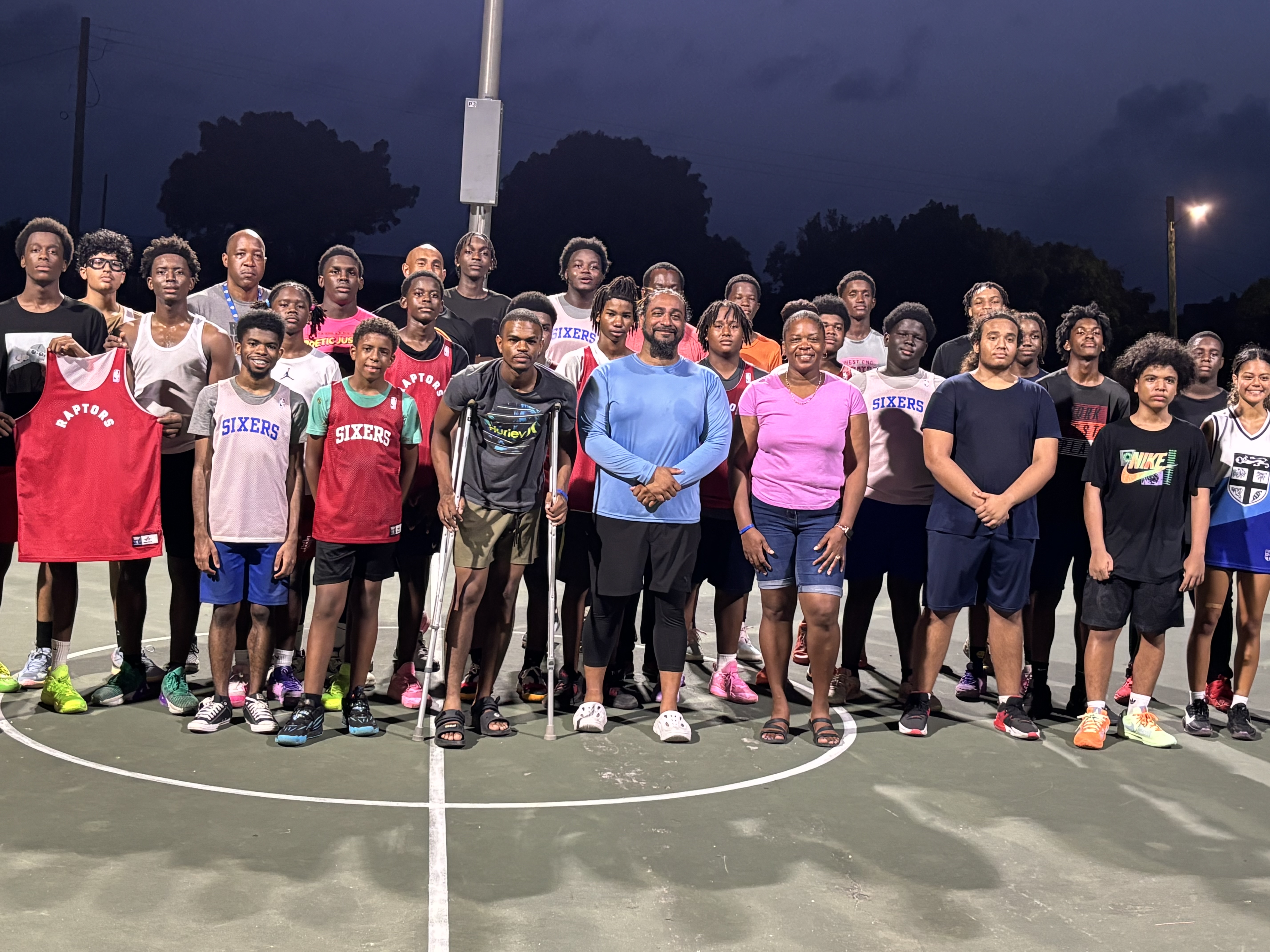 Basketball camp participants and coaches on the court